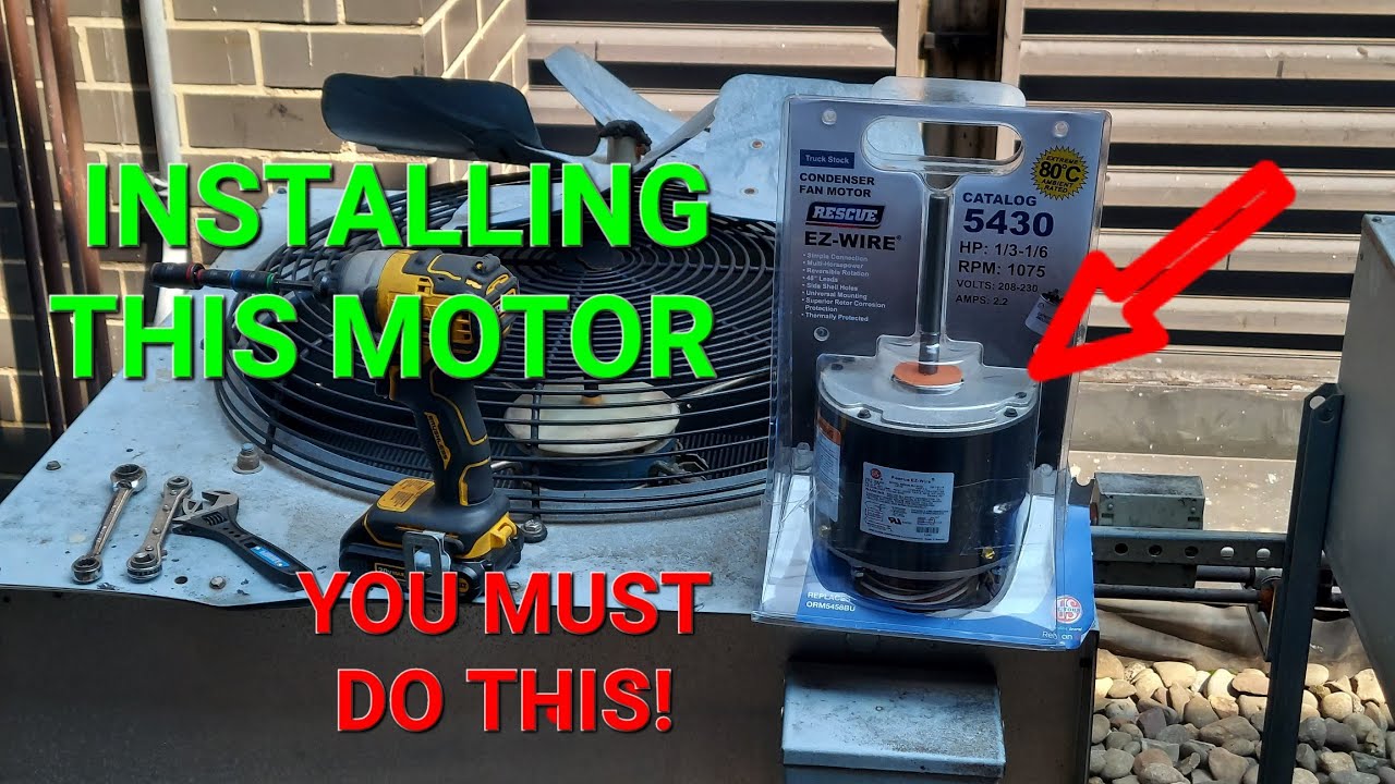 HVAC technician installing new condenser fan motor on outdoor AC unit